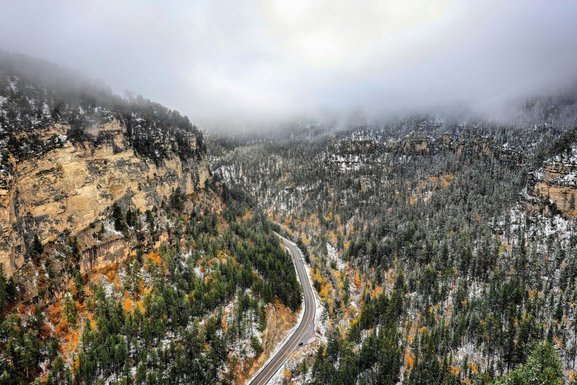 Overhead view of a winding mountain road in the midwest on a cloudy day