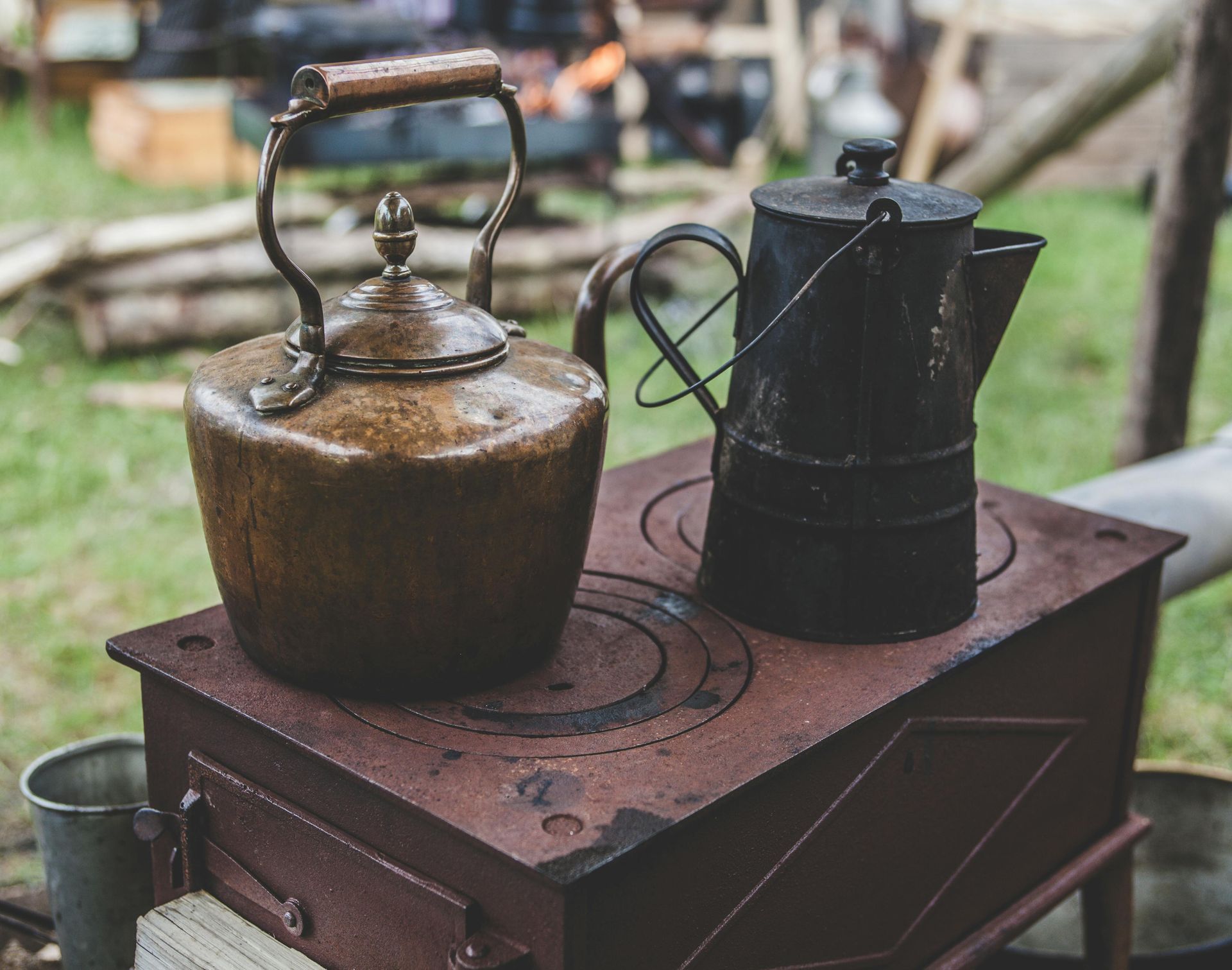 Home comfort items sitting on a wooden table in an outdoor setting