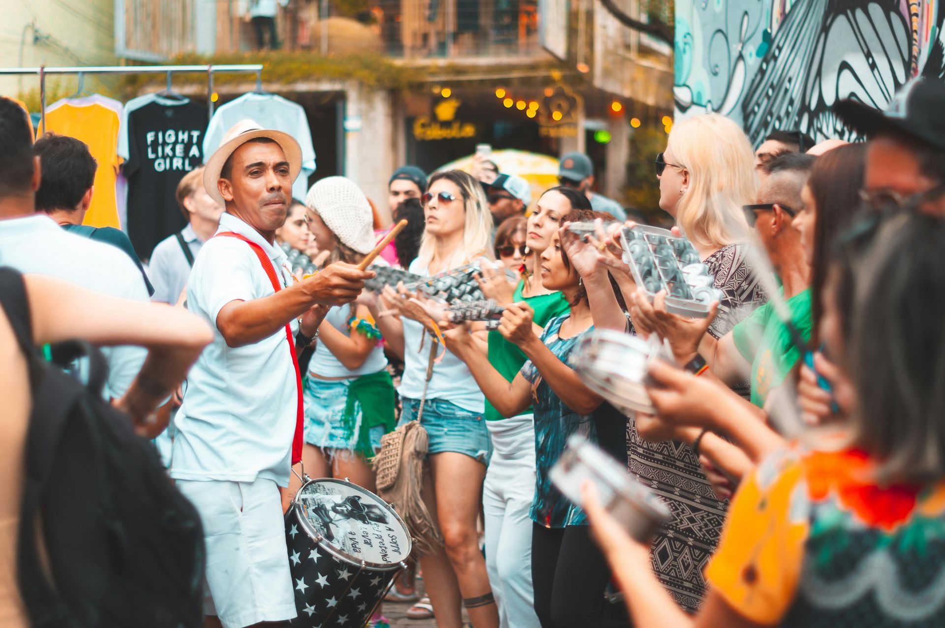 People outdoors in a large group during a street festival