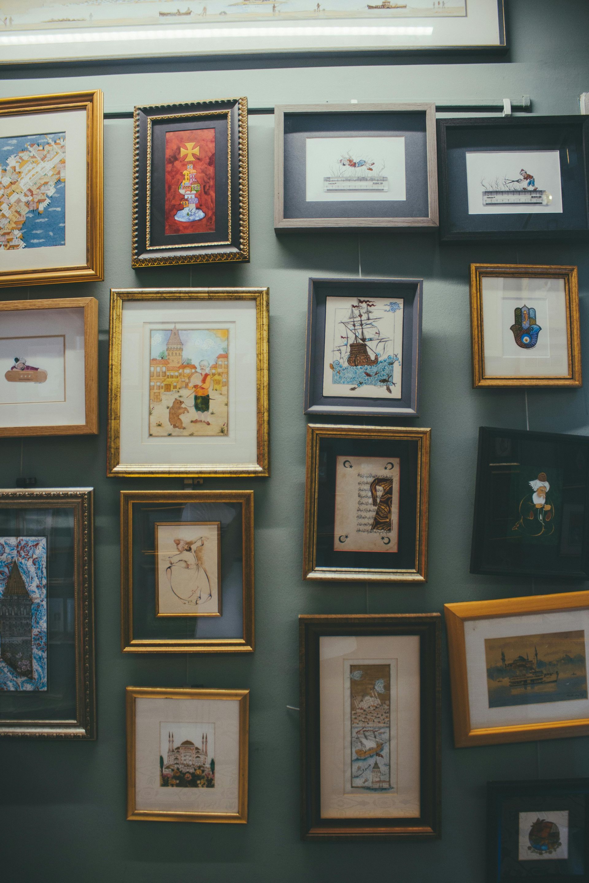 Old portraits and artifacts hanging in a museum