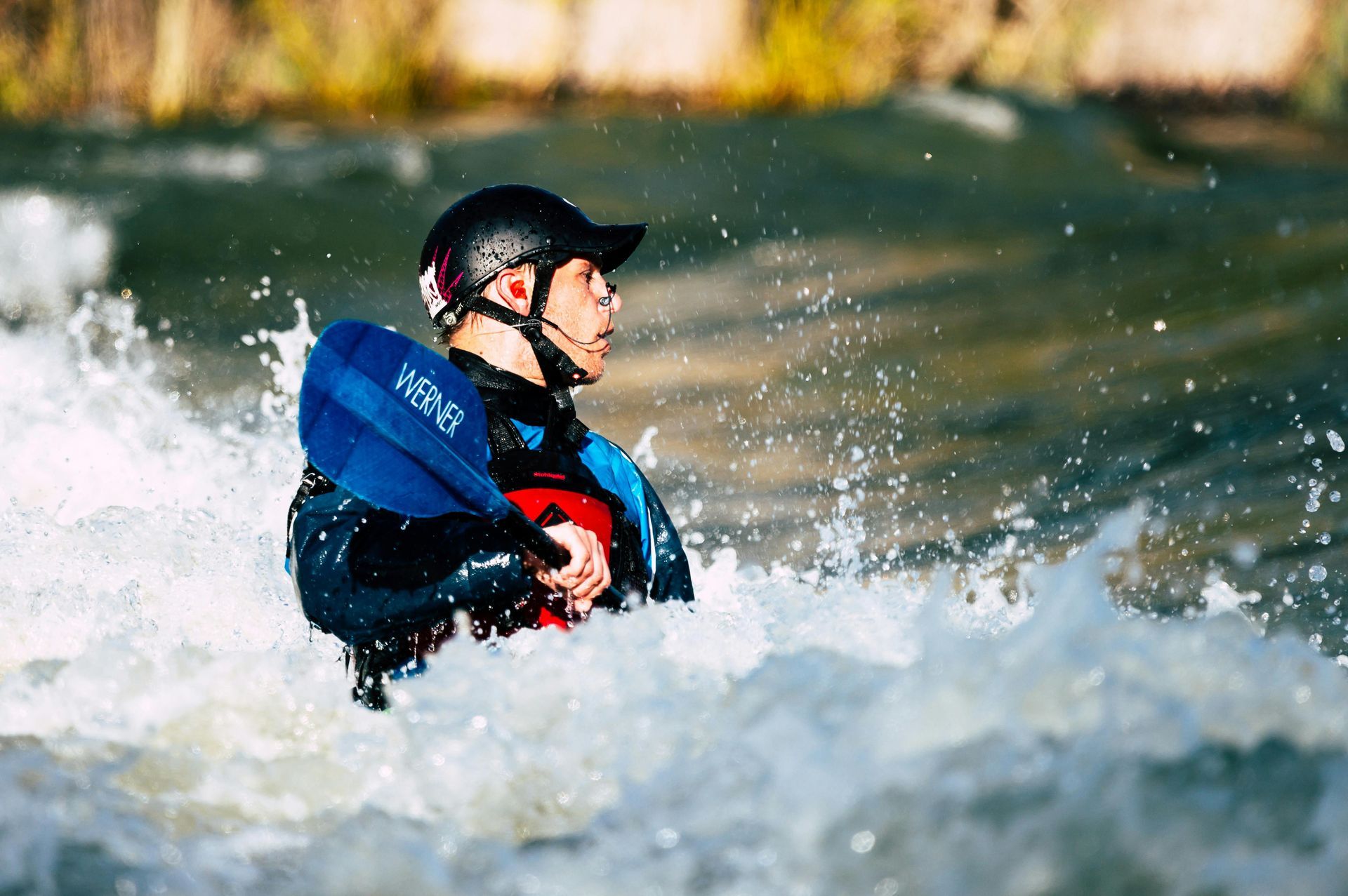 Person intensely kayaking down rapids in South Dakota
