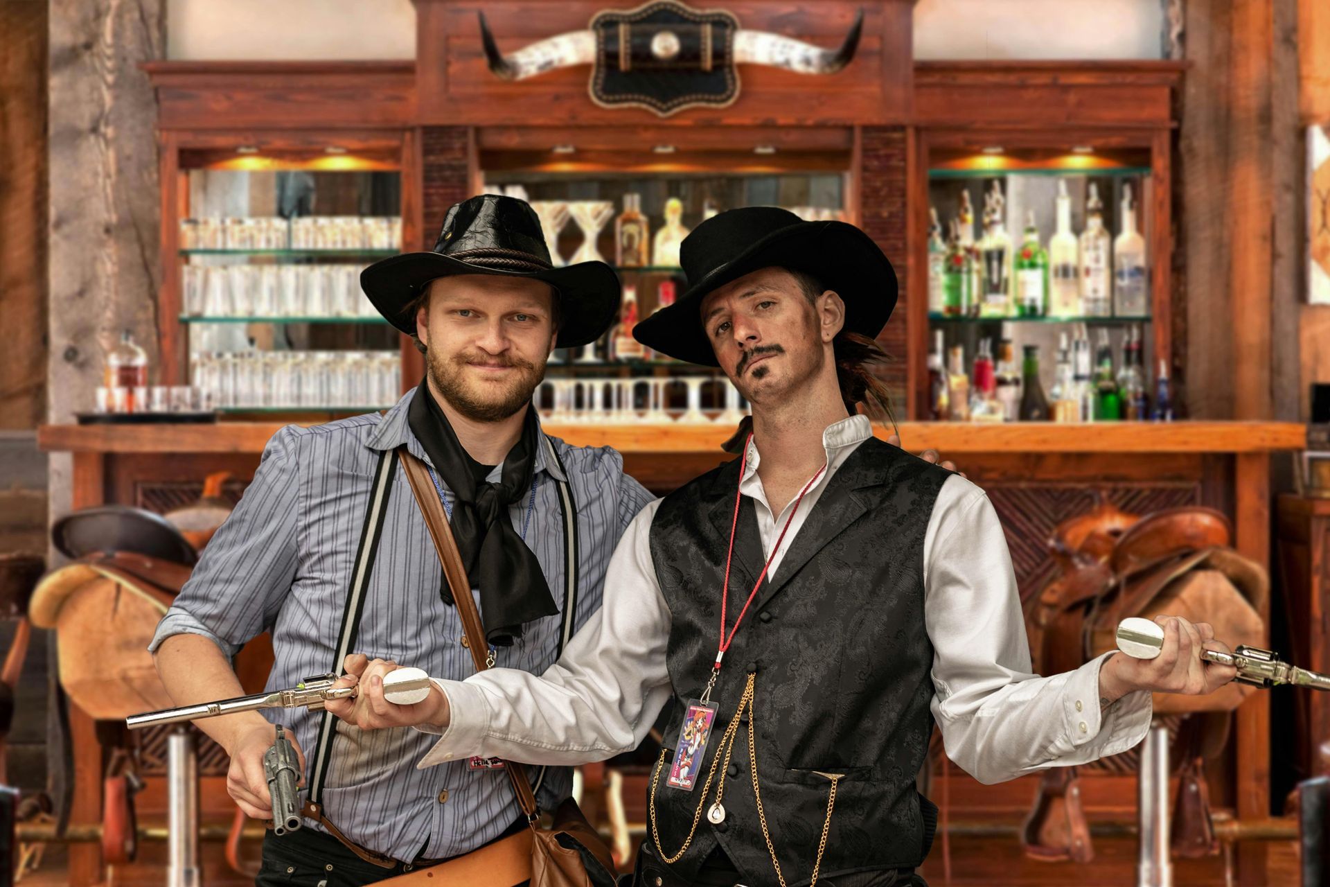 Two gunslingers in front of a saloon bar with their revolvers drawn