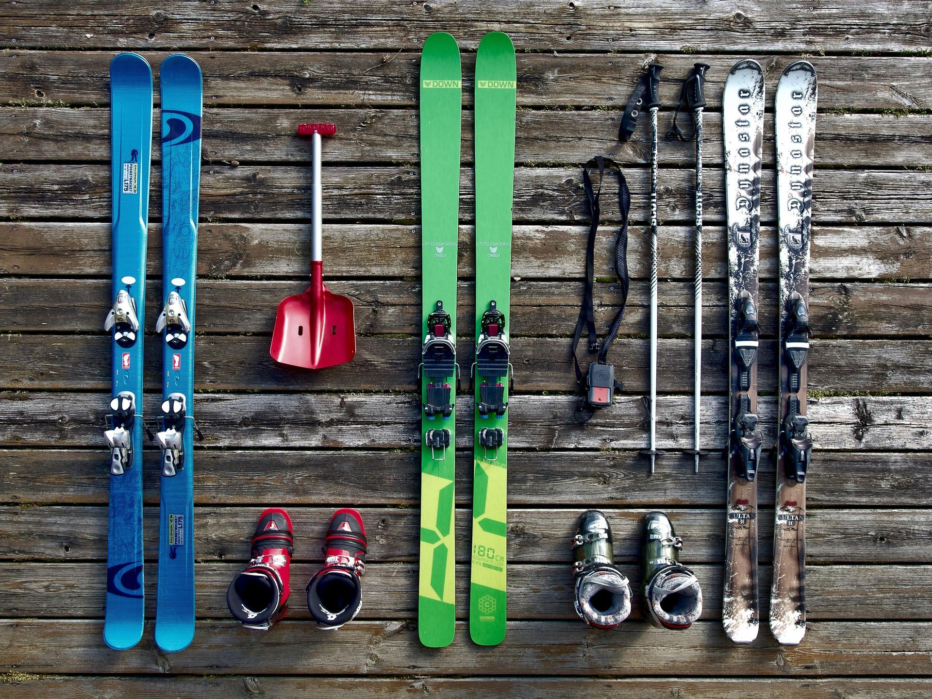 Displayed ski gear sitting out on wood floor