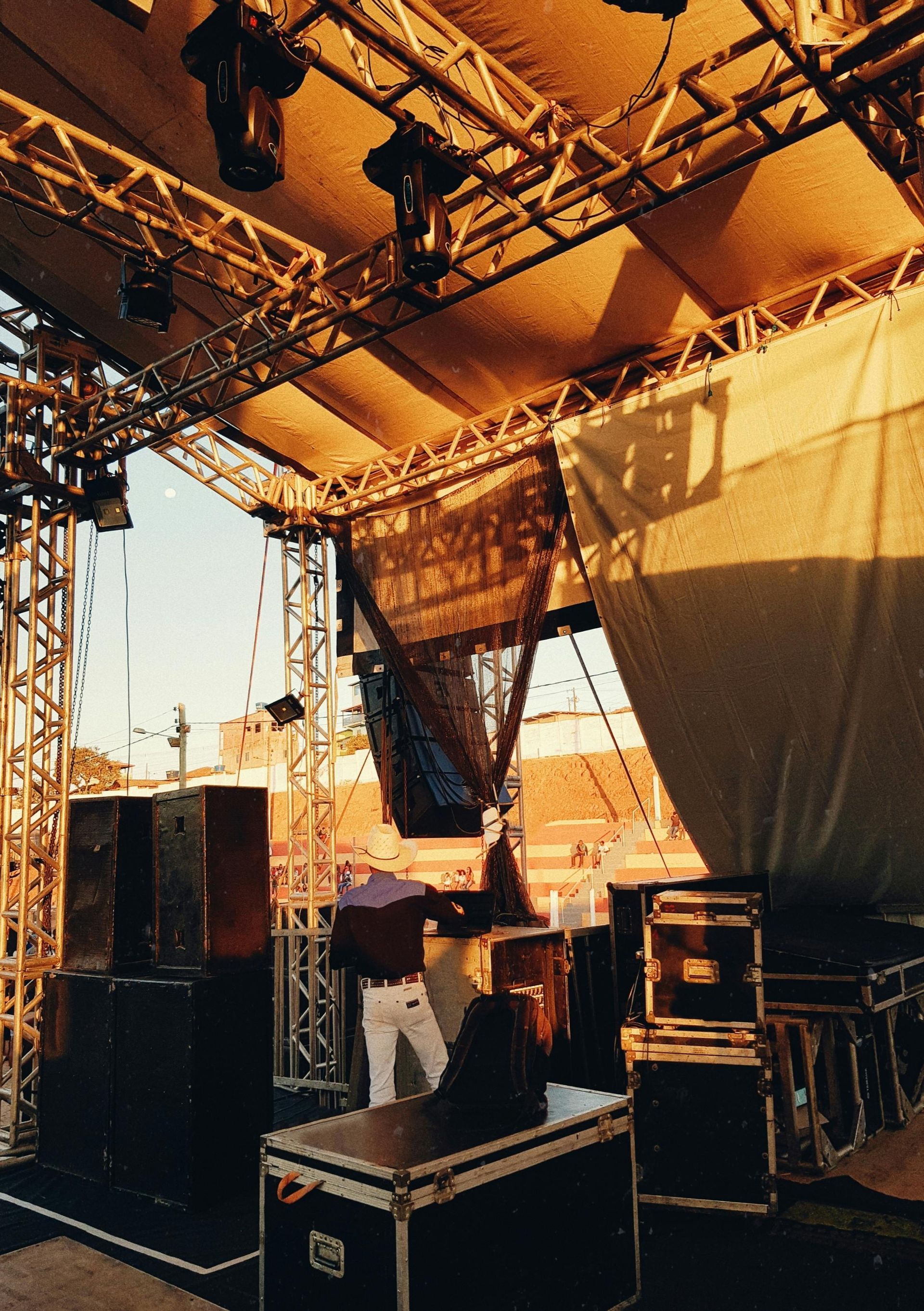 Cowboy on a venue stage preparing for a night of live music