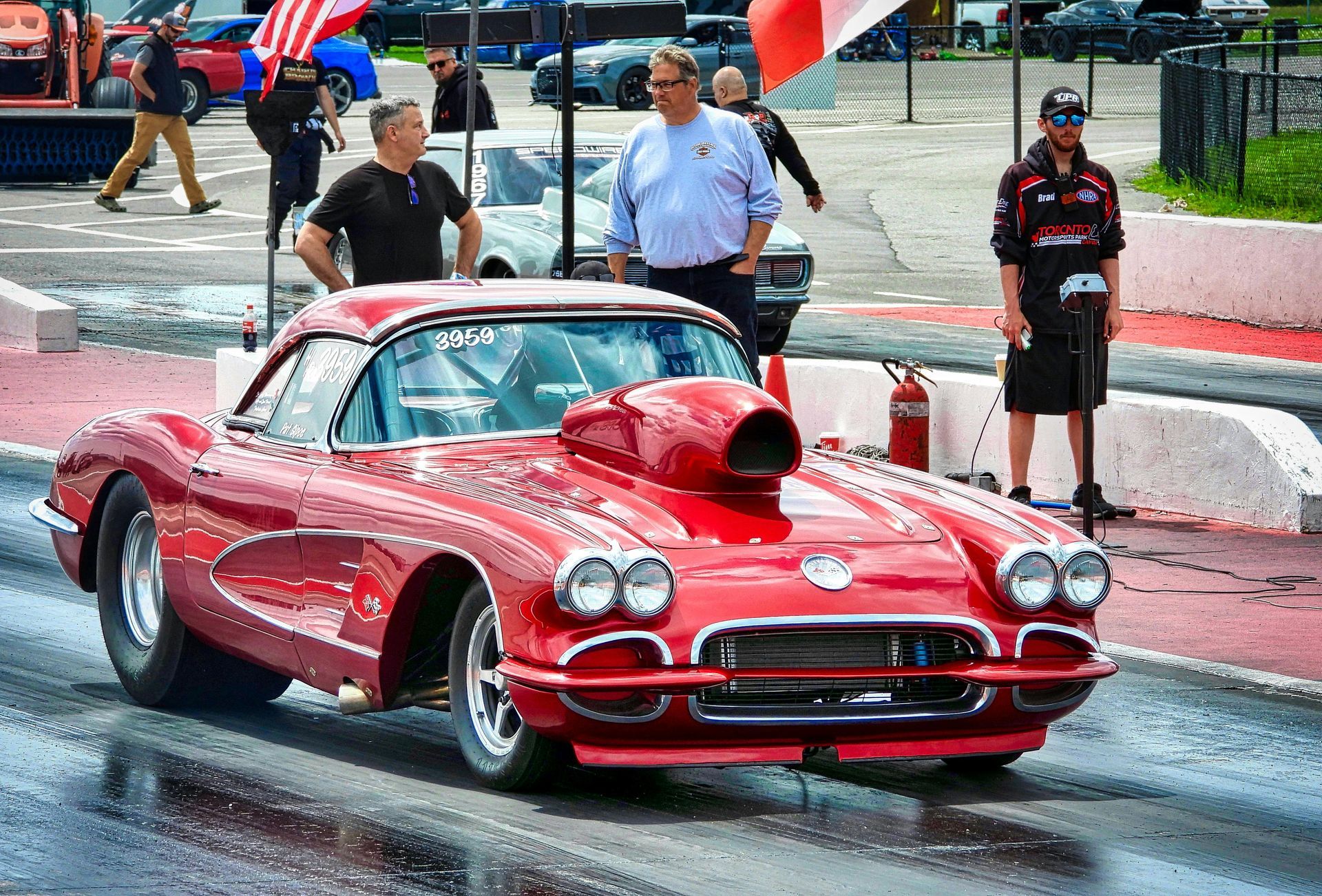 Old fashion red car with turbo engine sitting on the race track