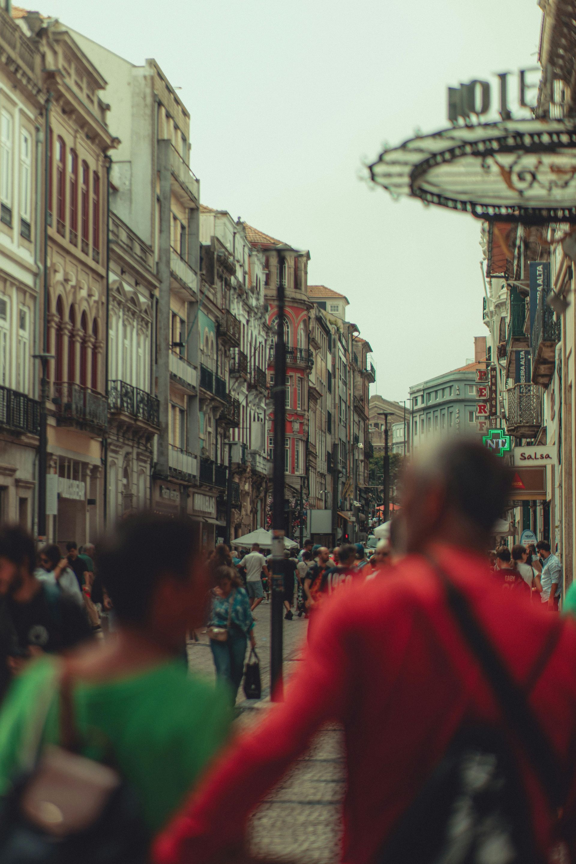 Group of people passing through busy streets and concert goers