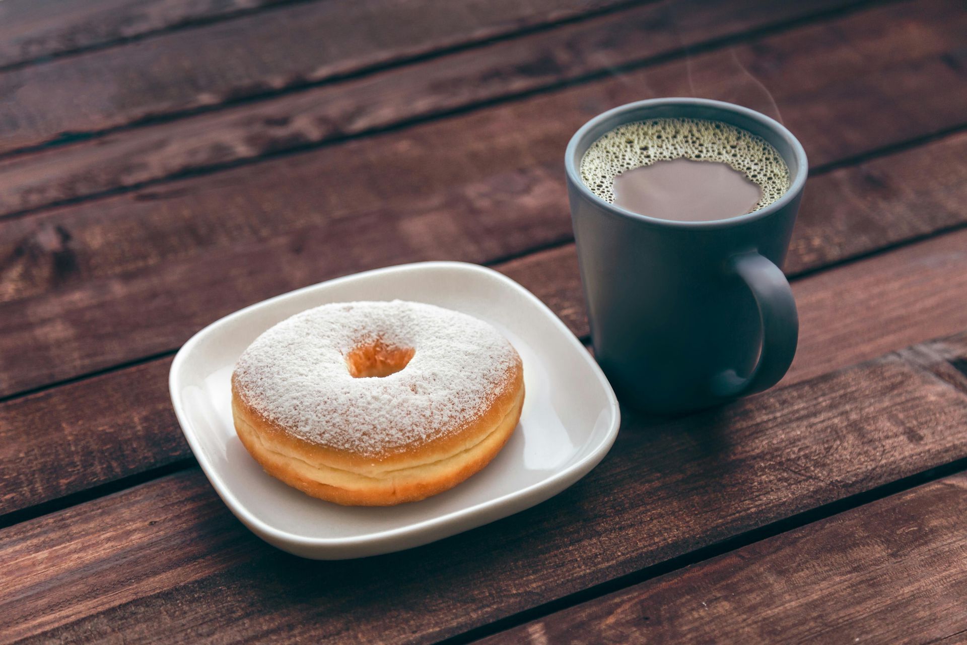 Classic coffee and donut sitting outside on a table to start your Deadwood morning