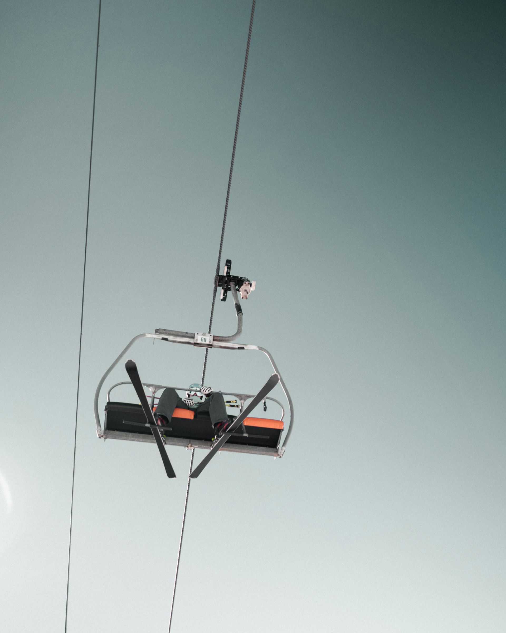 Ski lift with carrying a skier up to their next run