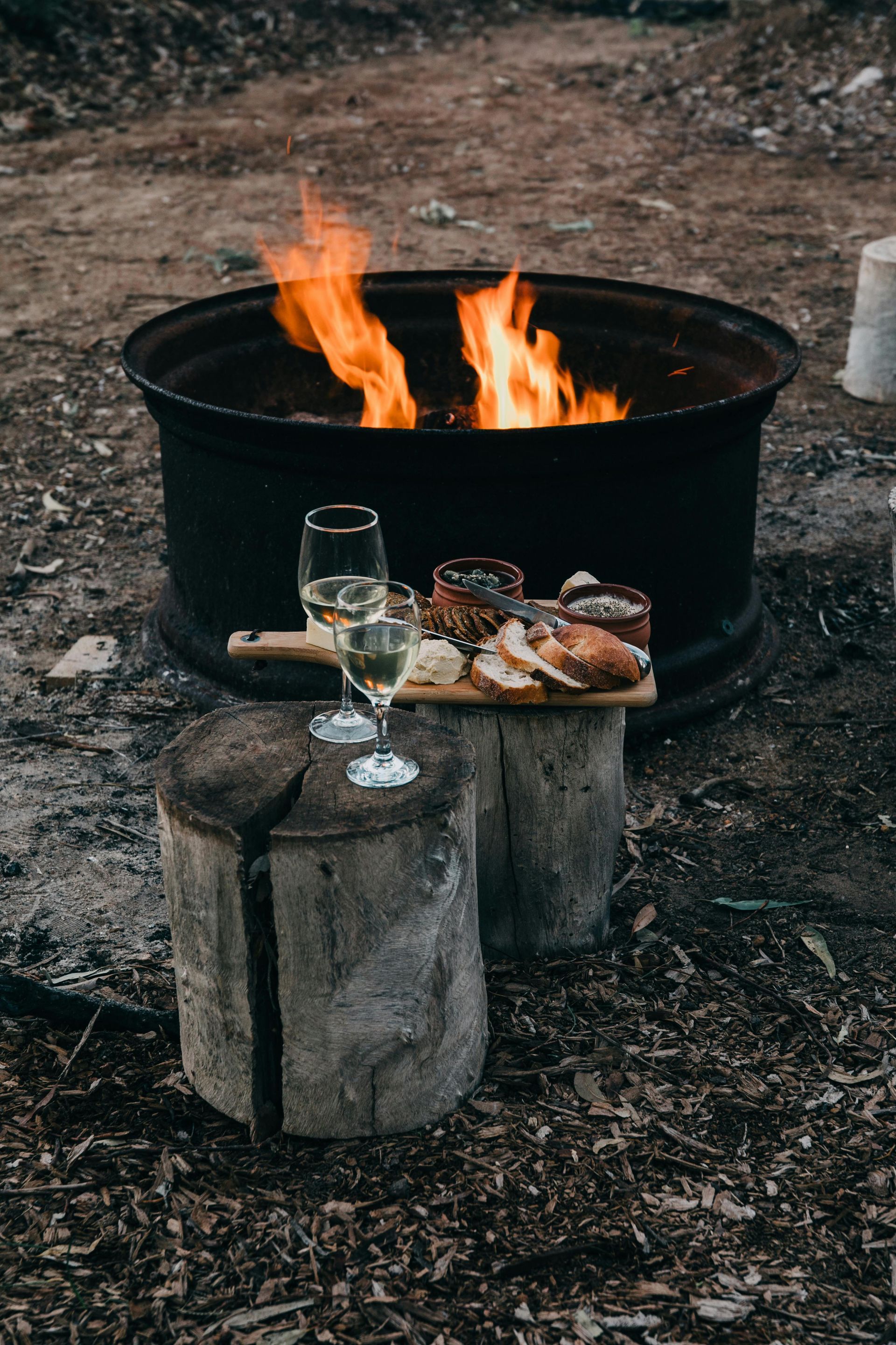 Snacks near an open campfire in the woods