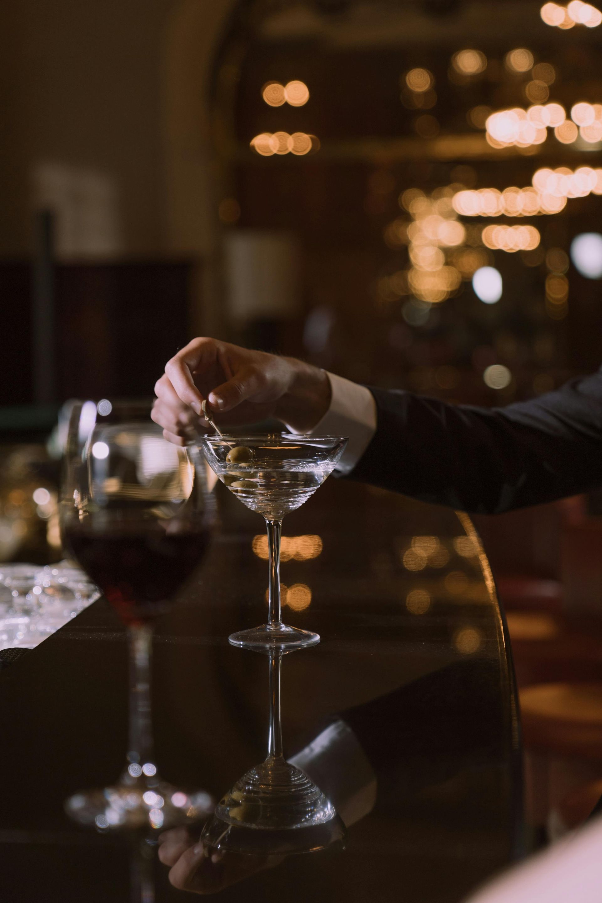Gentleman stirring a martini at a social club
