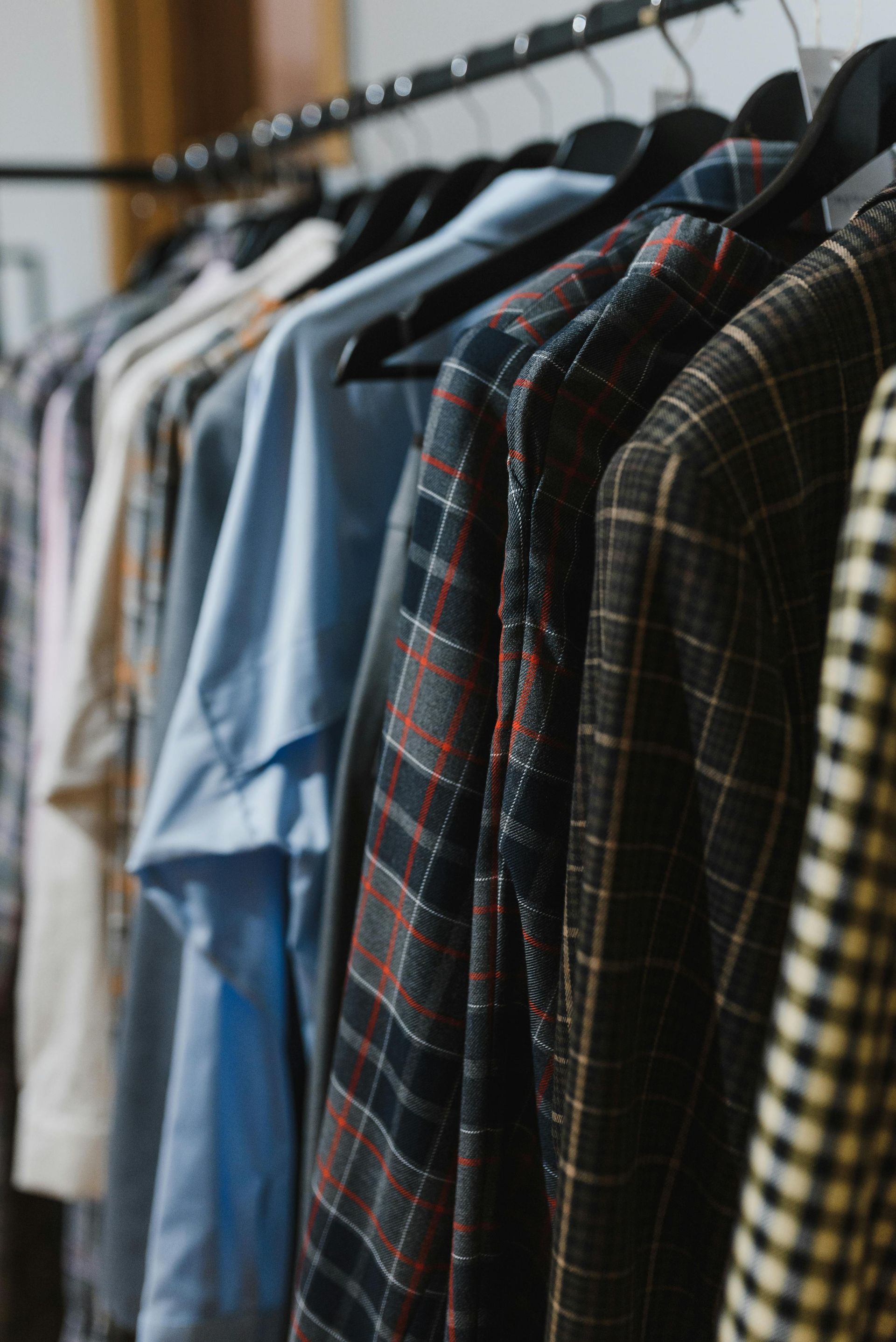Clothes for various temperatures hung up for traveling 