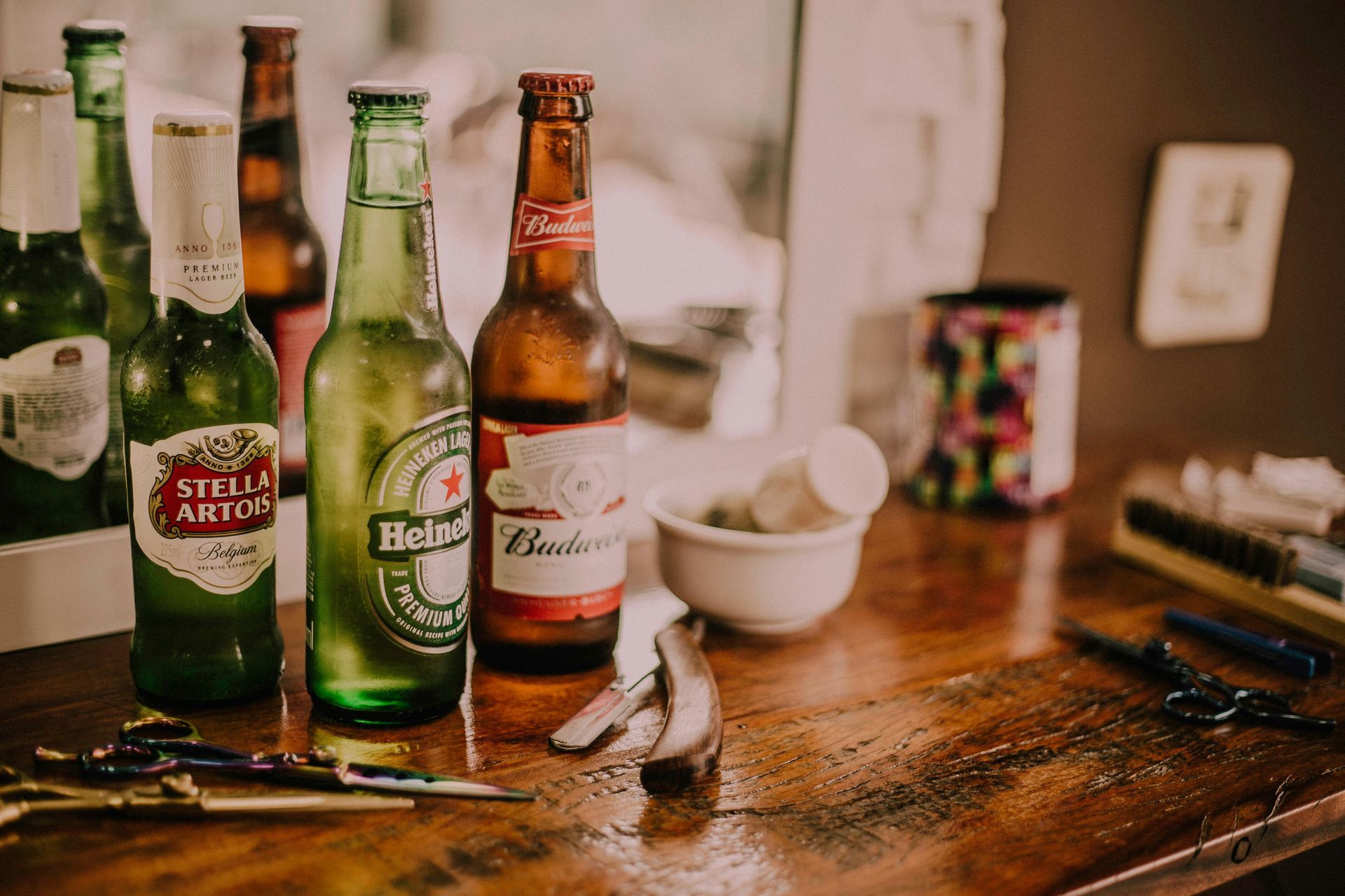 A variety of beers standing on a wooden table