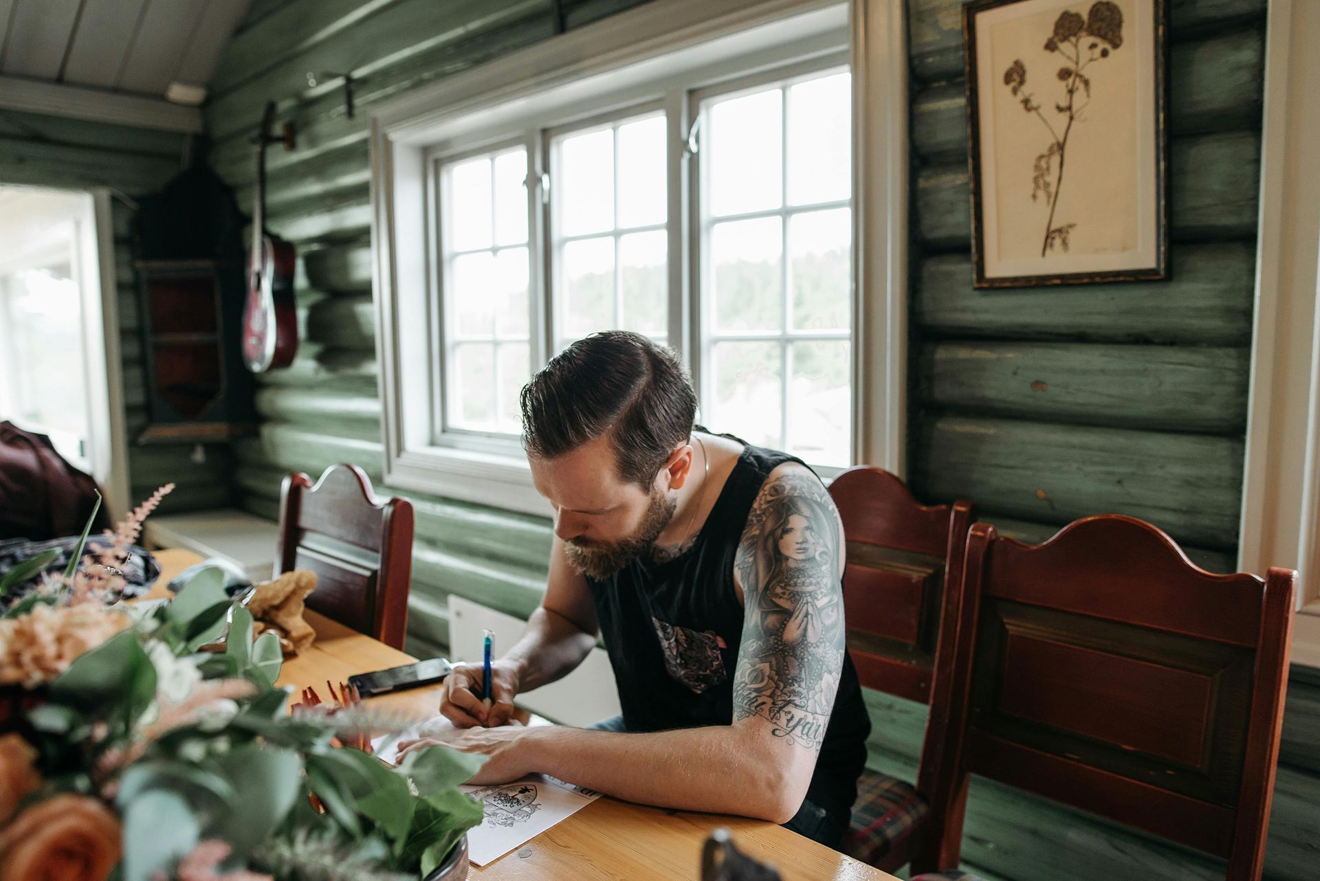 Man creating art in a cabin rental