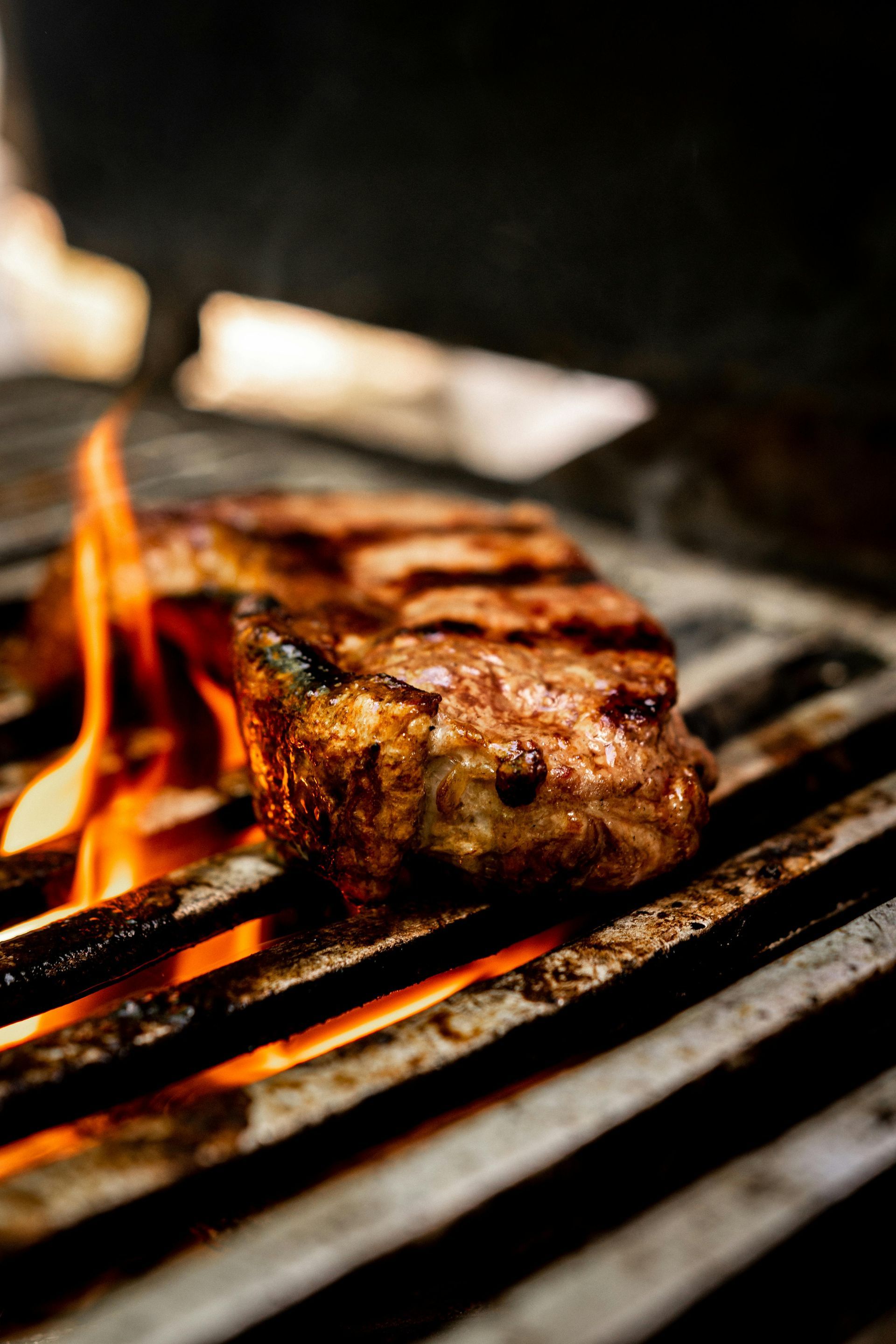 Steak being grilled over open fire