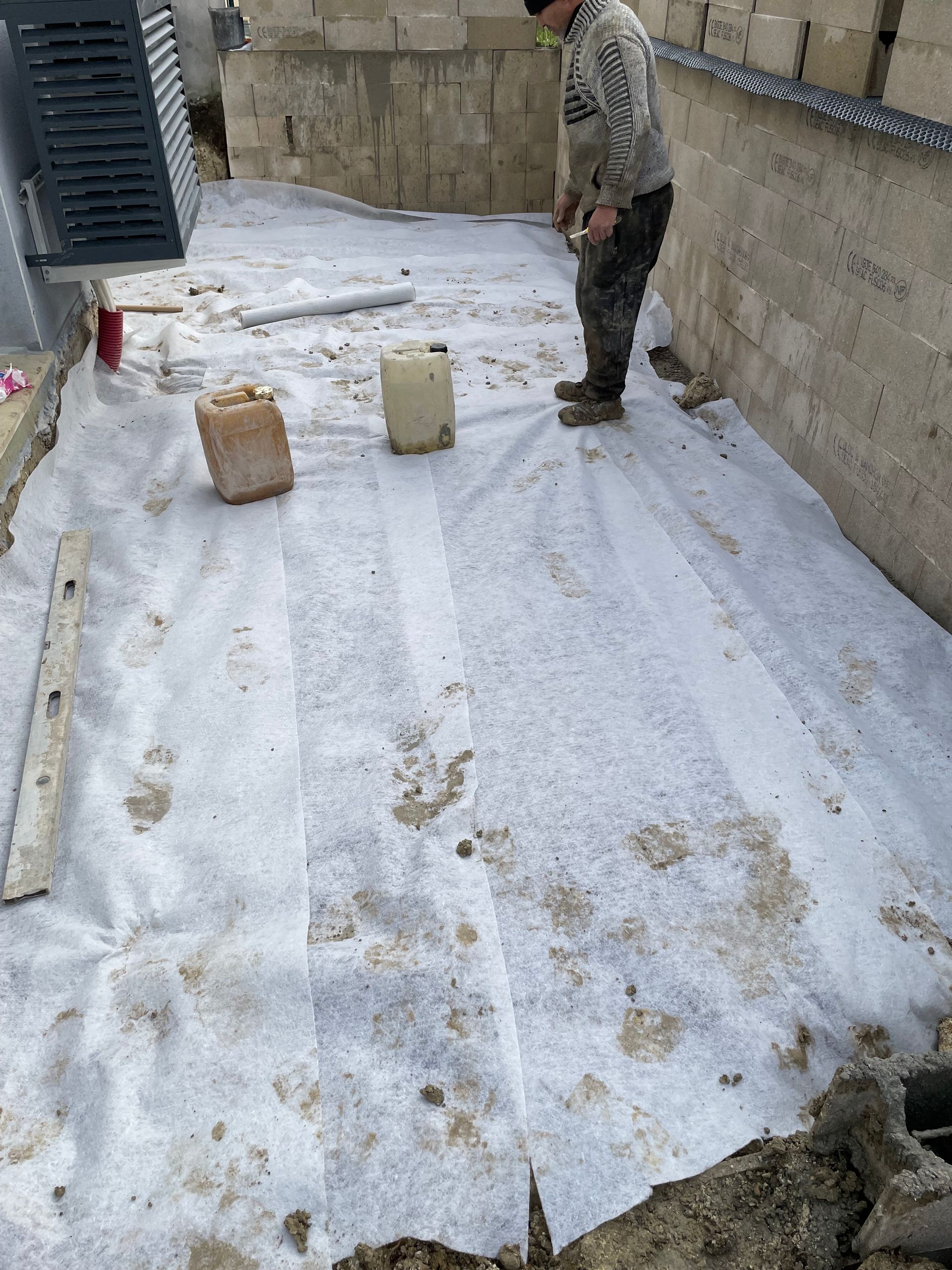 Bâche durant travaux de maçonnerie
