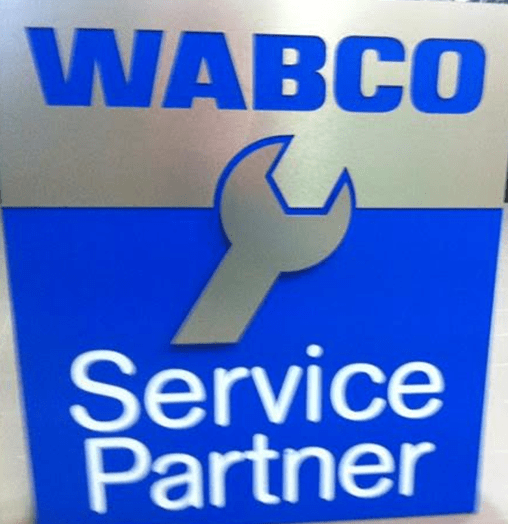 Uma placa de parceiro de serviço da Wabco com uma chave inglesa