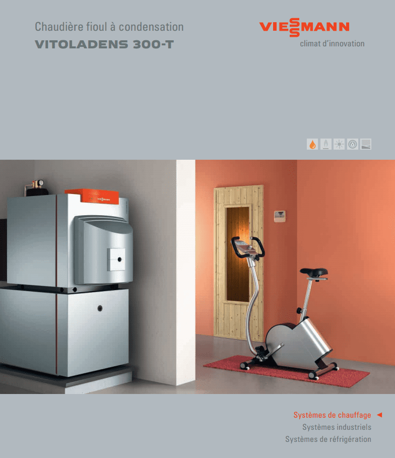 Chaudière à condensation Viessmann Vitoladens 300-T avec un vélo d'appartement dans une pièce aux murs orange.