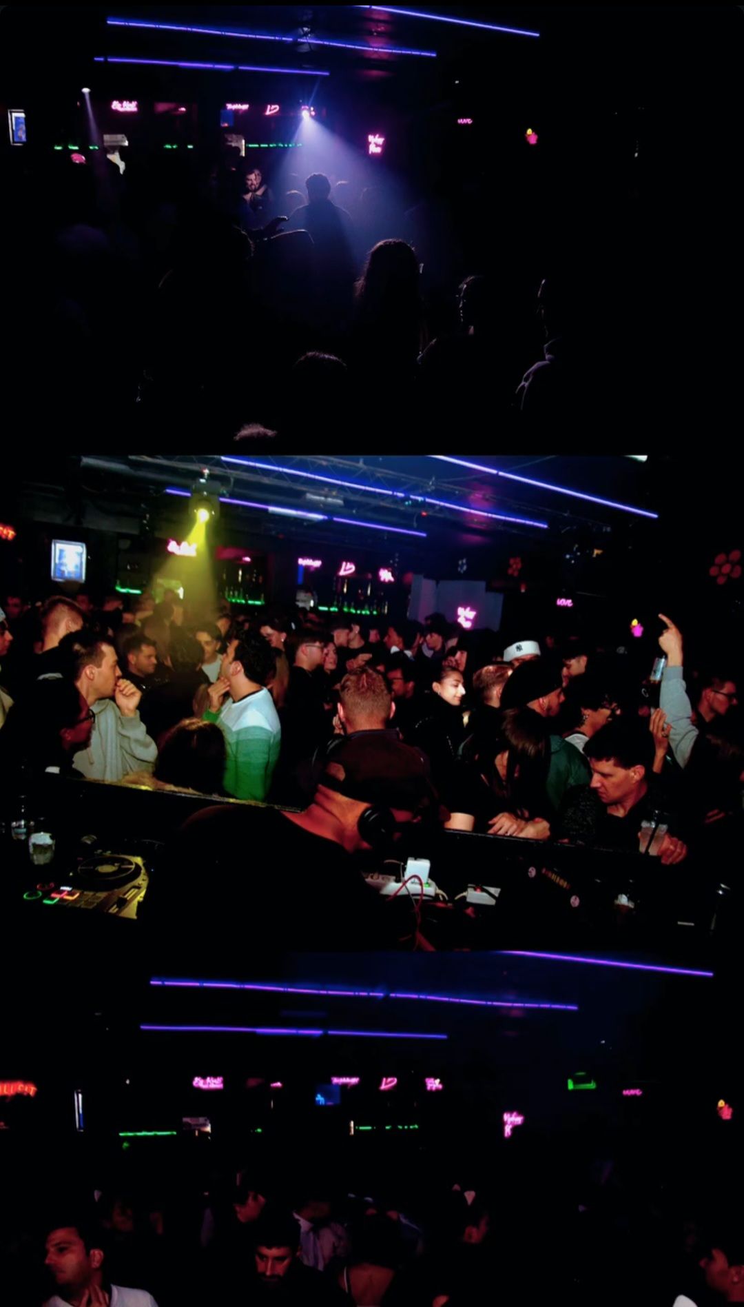 L'interno sfocato e scarsamente illuminato di una discoteca, con persone che ballano sotto luci di scena blu e rosa.