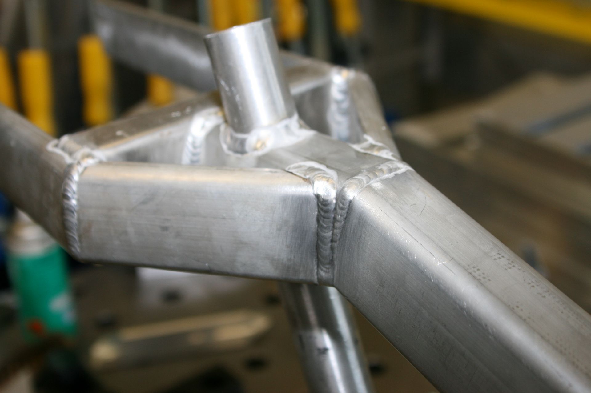 Picture of an raw finish Aluminium bicycle frame welded rear carrier
