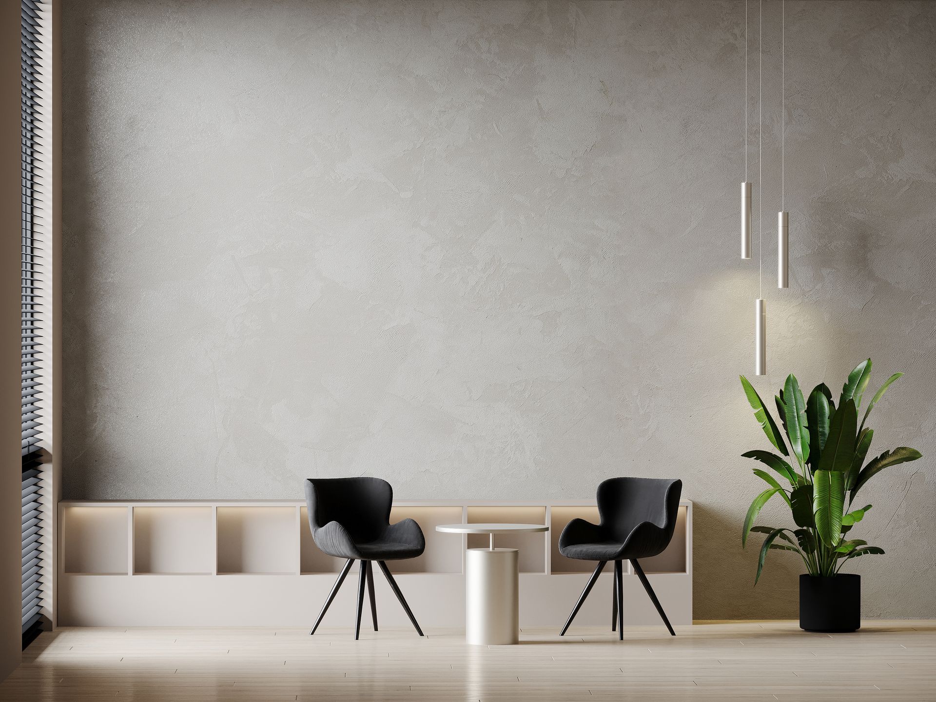 Salle d'attente moderne et minimaliste avec deux chaises noires, des étagères blanches et une plante en pot contre un mur gris.