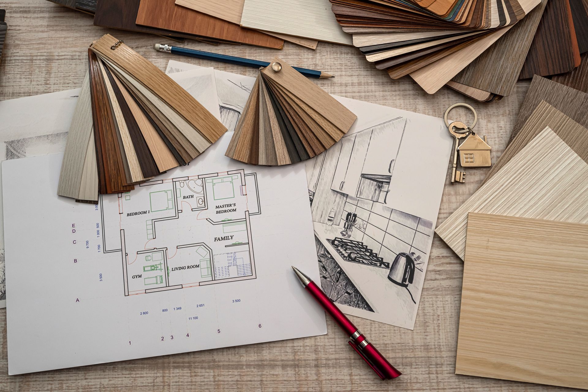 Espace de travail pour la conception architecturale avec carnet de croquis, nuancier, règle, crayon et échantillons de tissu.