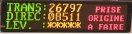 Affichage indiquant : TRANS:26797, DIREC:08511, LEV: ******, PRISE, ORIGINE, A FAIRE en texte vert, jaune et rouge.