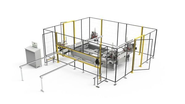 Machine industrielle automatisée entourée d'une clôture de sécurité noire et jaune dans un environnement d'usine
