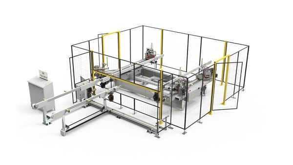 Machine d'emballage industrielle à l'intérieur d'une cage de sécurité avec panneaux grillagés à cadre jaune