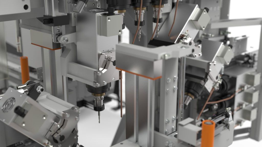 Bras robotisés industriels travaillant à l'intérieur d'une cellule d'automatisation d'usine, avec des câbles et des machines métalliques.