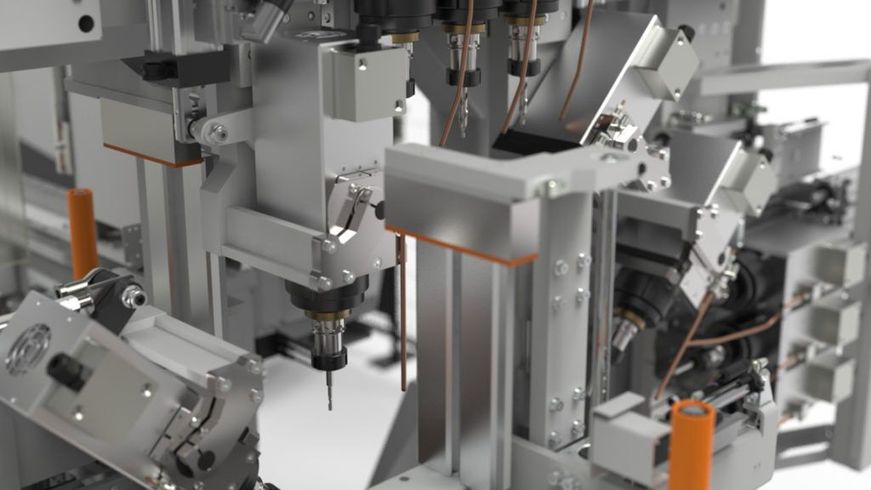 Bras robotisés industriels travaillant à l'intérieur d'une cellule d'automatisation d'usine, avec des câbles et des machines métalliques.