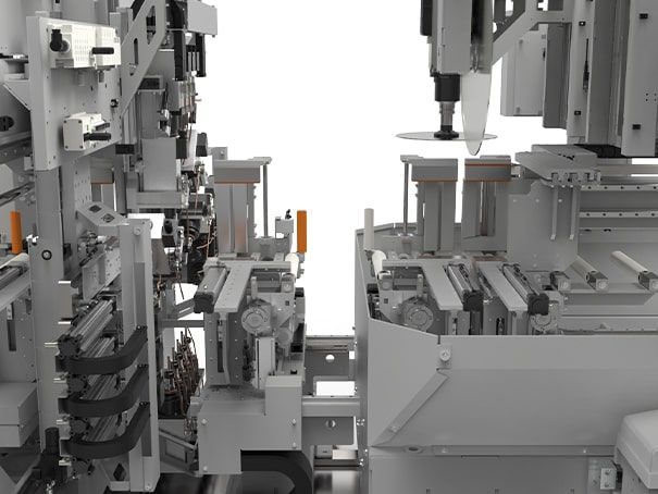 Chaîne de montage de machines industrielles avec équipements robotisés gris dans un environnement d'usine