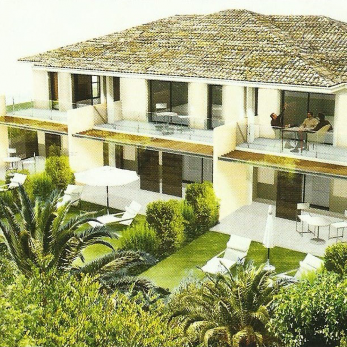 Une impression d'artiste d'une maison entourée de palmiers