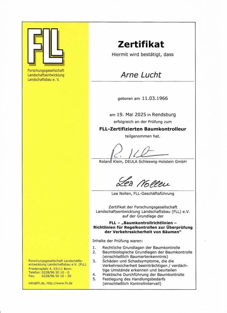 Eine gelb-weiße Urkunde mit einer Unterschrift darauf.