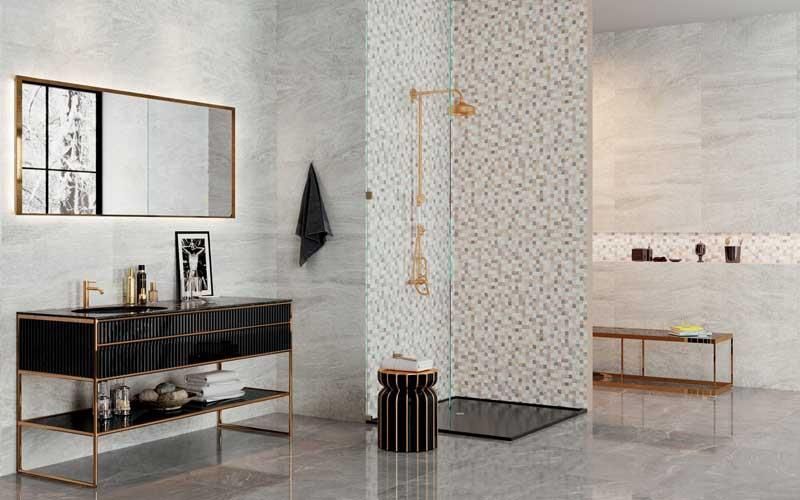 Ein Badezimmer mit Waschbecken, Spiegel und Dusche.