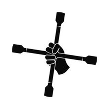 Croix démonte-roue tenue par un mécanicien