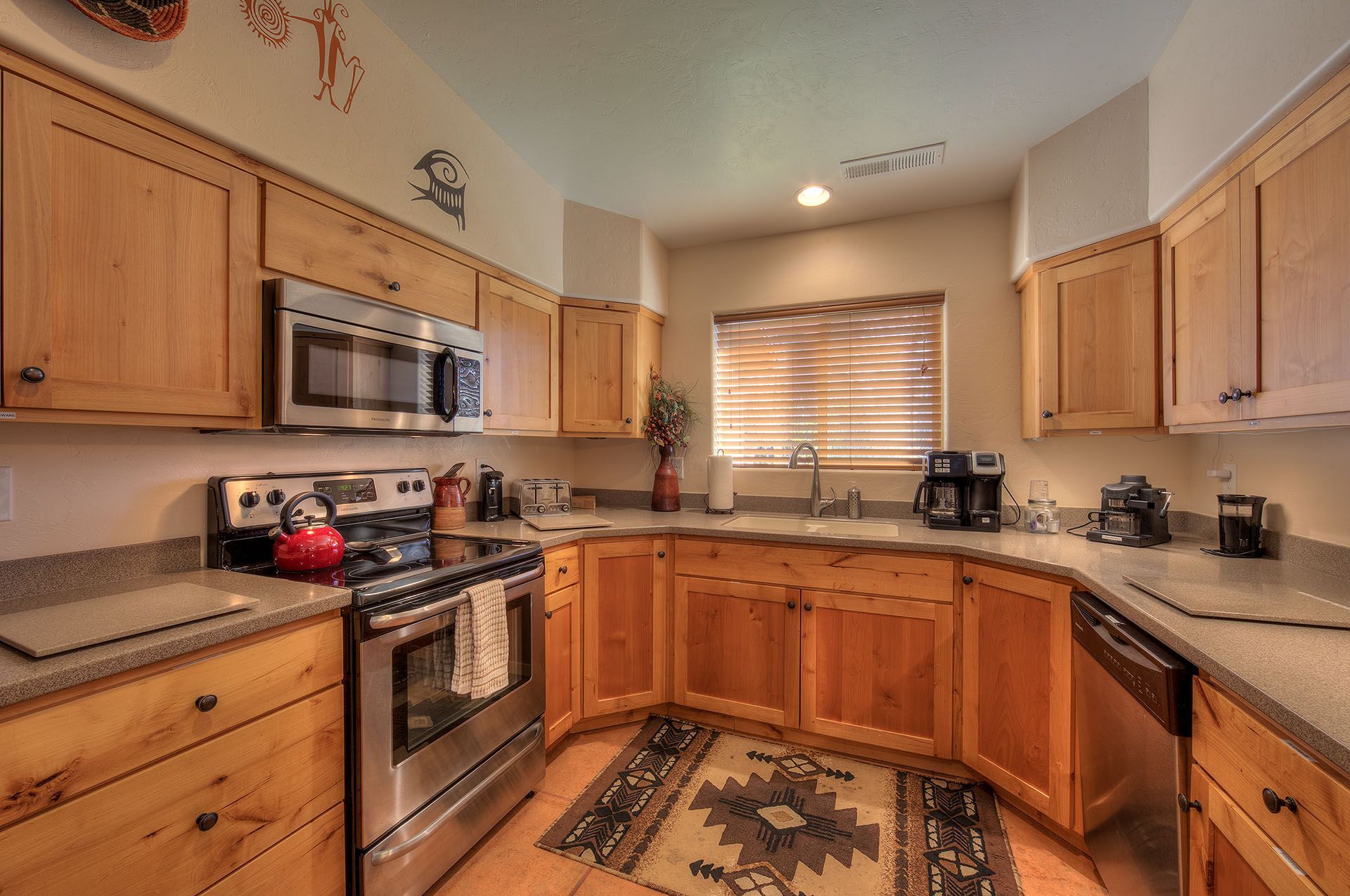 Moab, Utah Oleander Place vacation rental Kitchen with light wood cabinets, stainless steel appliances