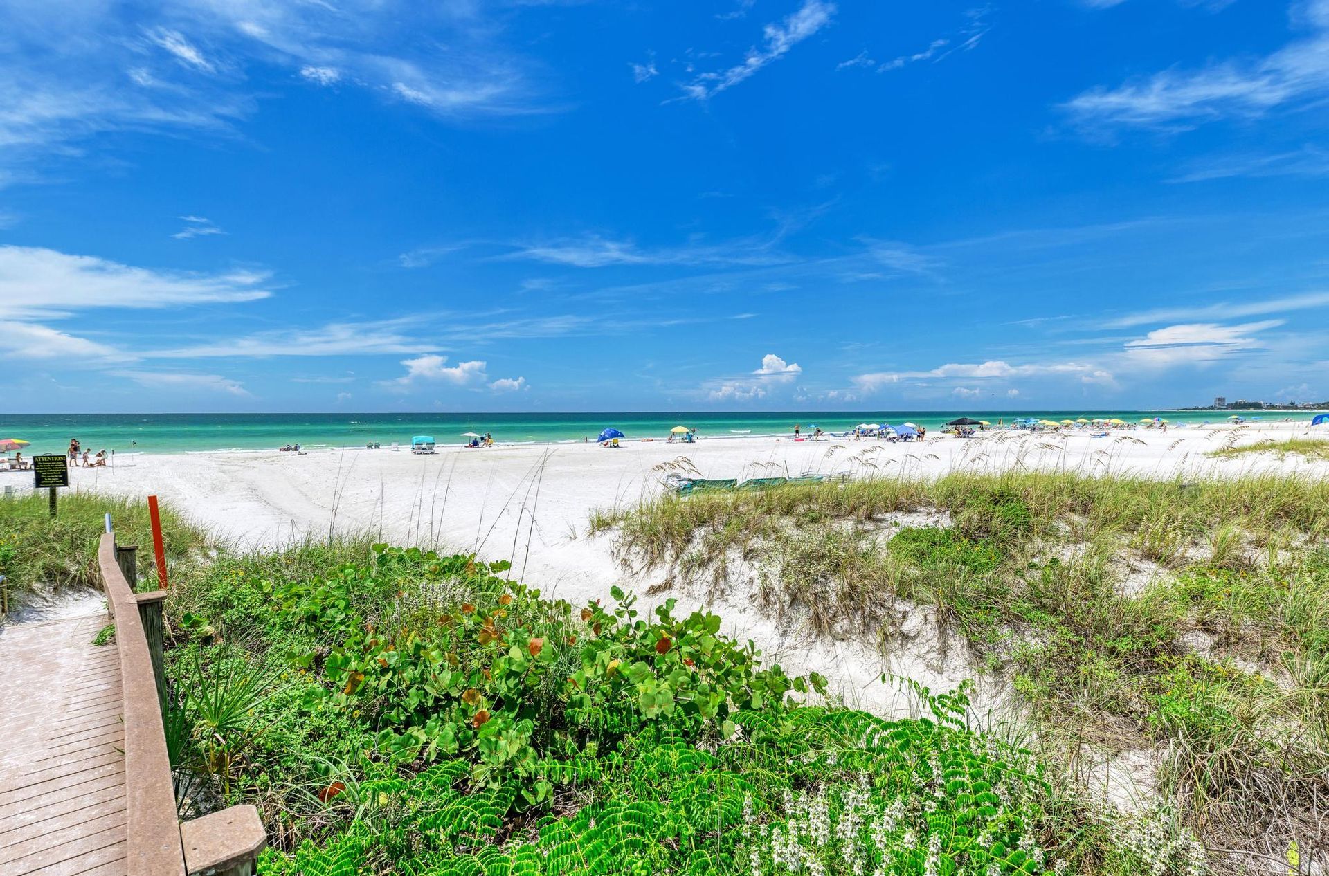 There is a wooden walkway leading to the Siesta Key beach near Sarasota Florida
