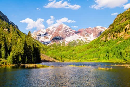 A lake in mountain valley with  Maroon Bells near our Aspen Colorado Chalet 976 vacation rental