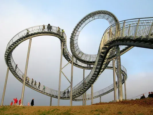 Tiger and Turtle – Magic Mountain. A roller coaster with stairs going up to the top of it