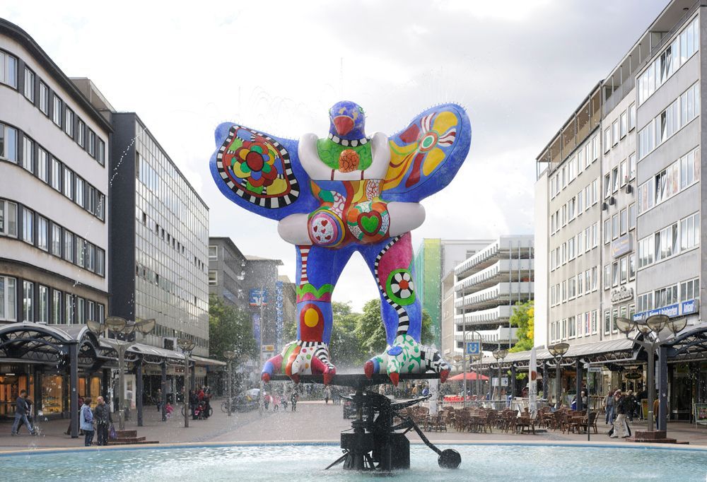 Lifesaver Fountain (Lifesaver Brunnen). A fountain with a colorful statue in the middle of it