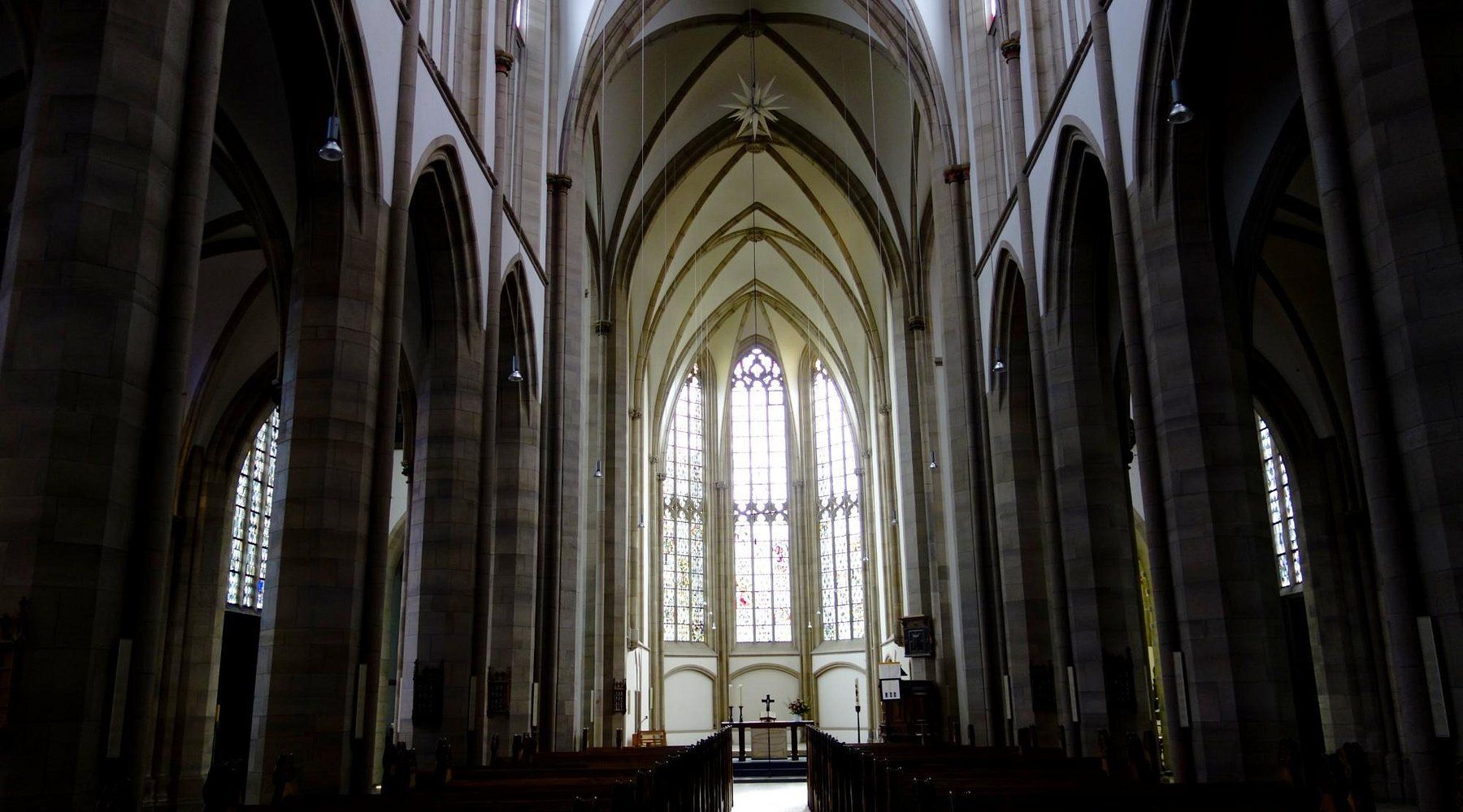 Salvatorkirche (Salvator Church). The inside of a church with a vaulted ceiling and stained glass windows.