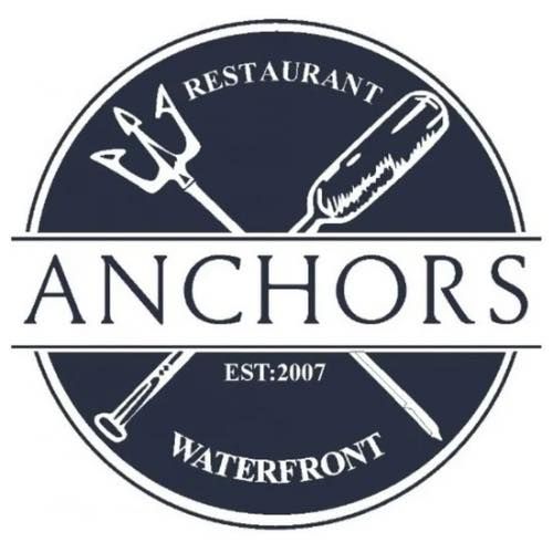 Logo for Anchors Waterfront Restaurant. Dark blue circle with white text and graphic. Trident and oar crossed.