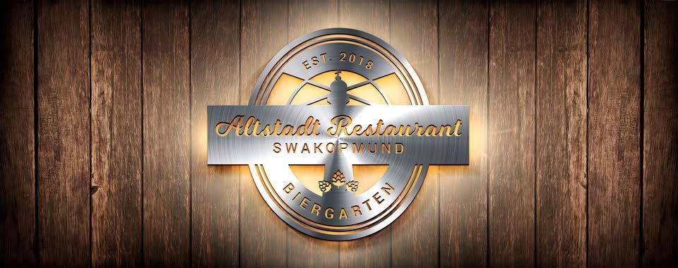 Restaurant logo on wooden background, with text and metallic embellishments.