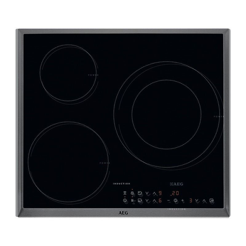 Una estufa de inducción de color negro con tres círculos encima.