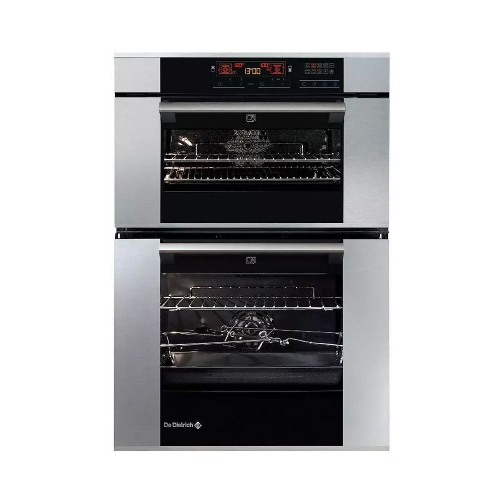 Un horno doble de acero inoxidable con puerta negra.