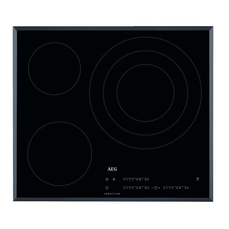 Una placa de inducción negra con tres círculos encima