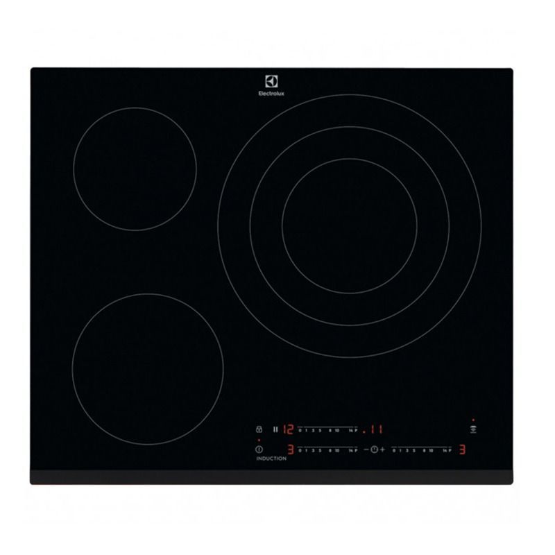 Una estufa de inducción de color negro con tres círculos encima.