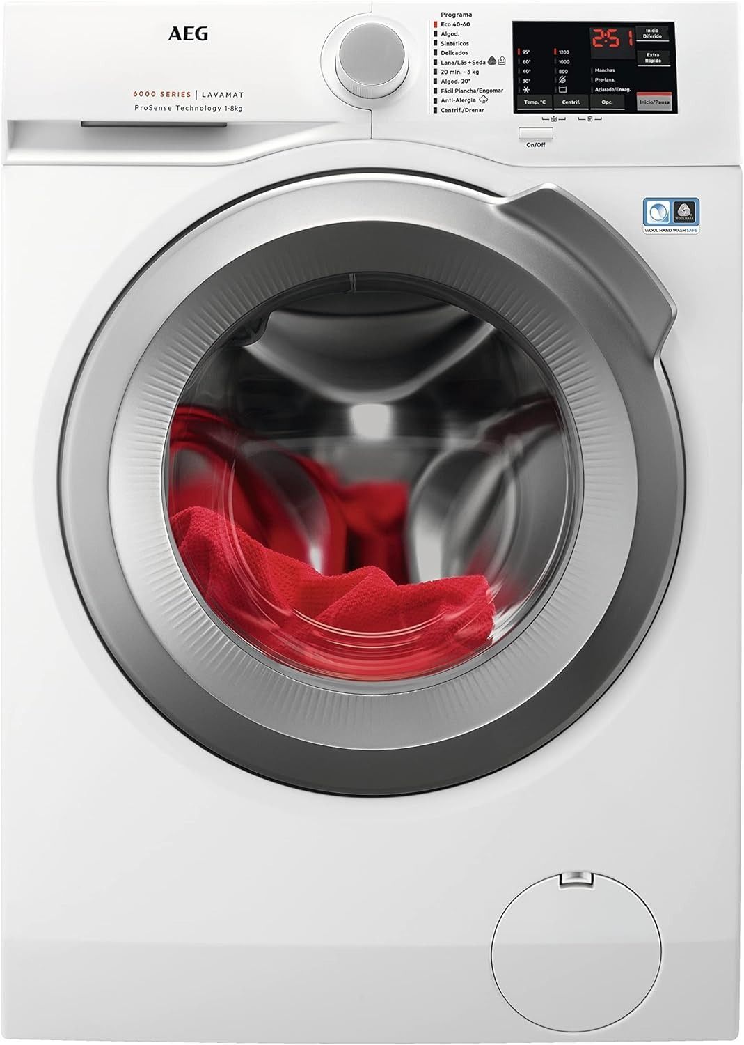 Una lavadora blanca con ropa roja dentro.