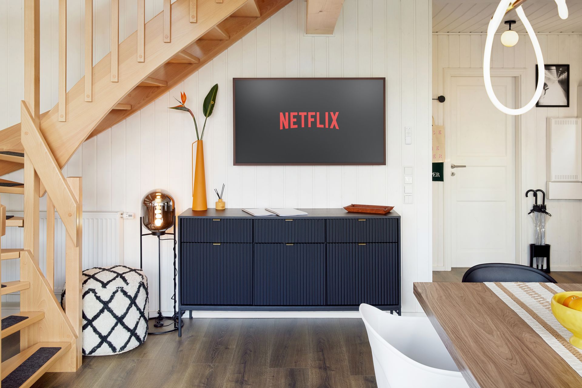 TV and sideboard next to the staircase