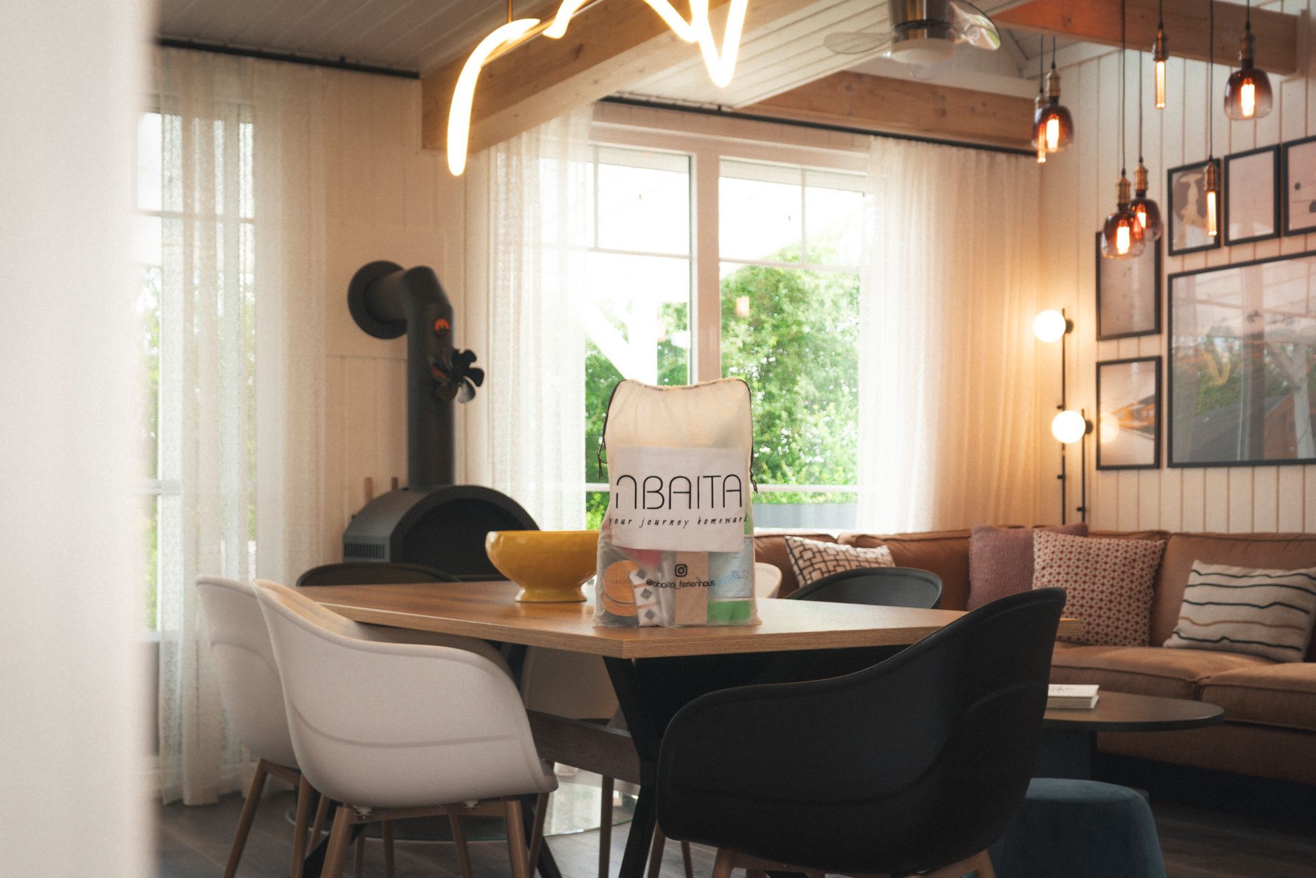 Breakfast table by the window with the wood stove behind